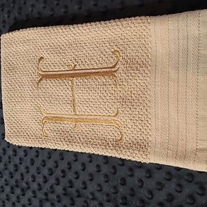 Embroidered H on a tan  dish towel  26 L X 15 1/2 W